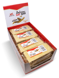 White Chocolate Cherry Delicious Oat Bar, featuring cherry pieces and a white chocolate coating.